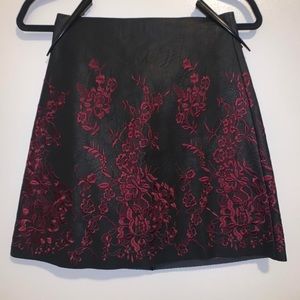 Club Monaco a-line faux leather skirt with red floral embroidery